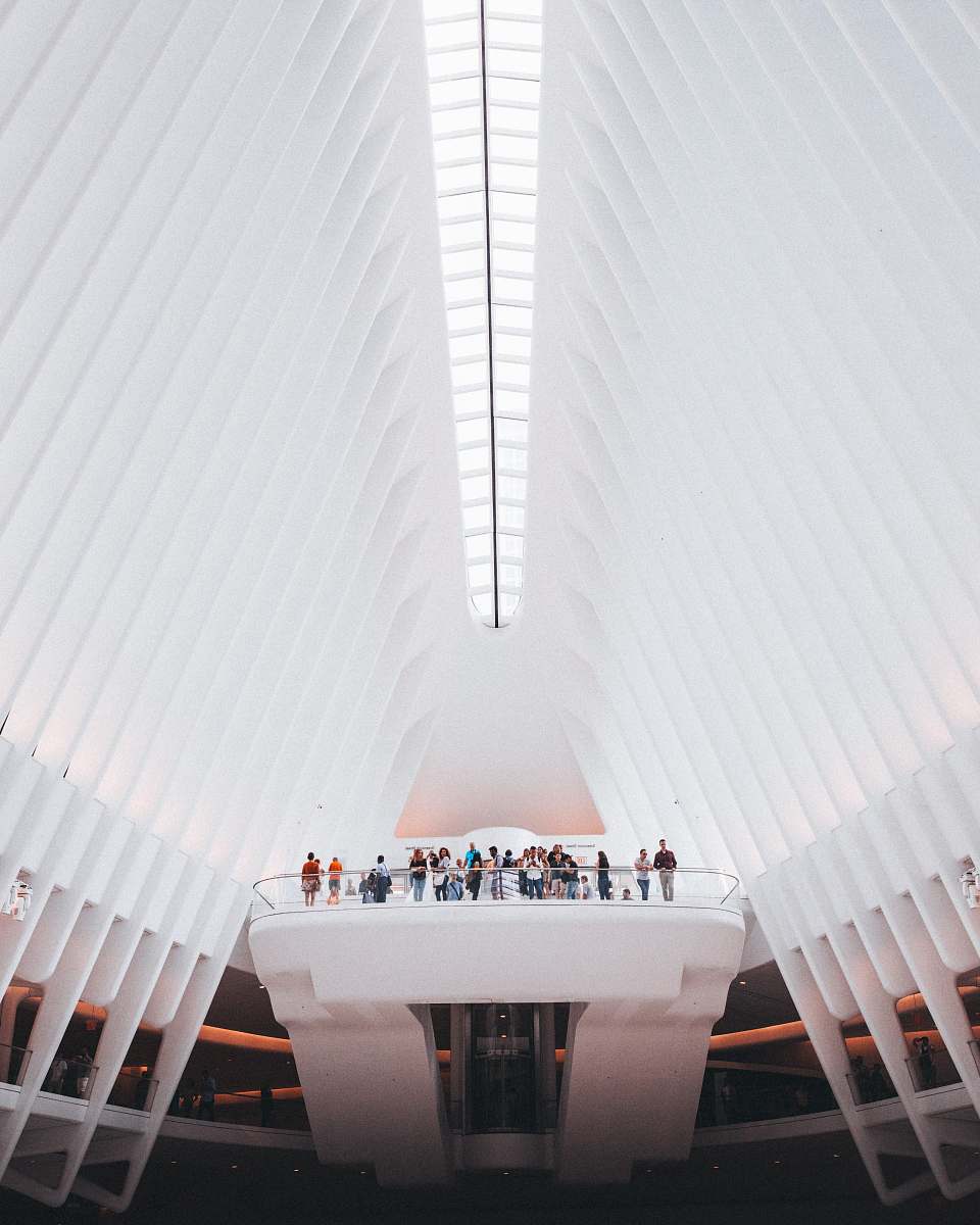 new york people standing near balusters under white high ceiling architecture